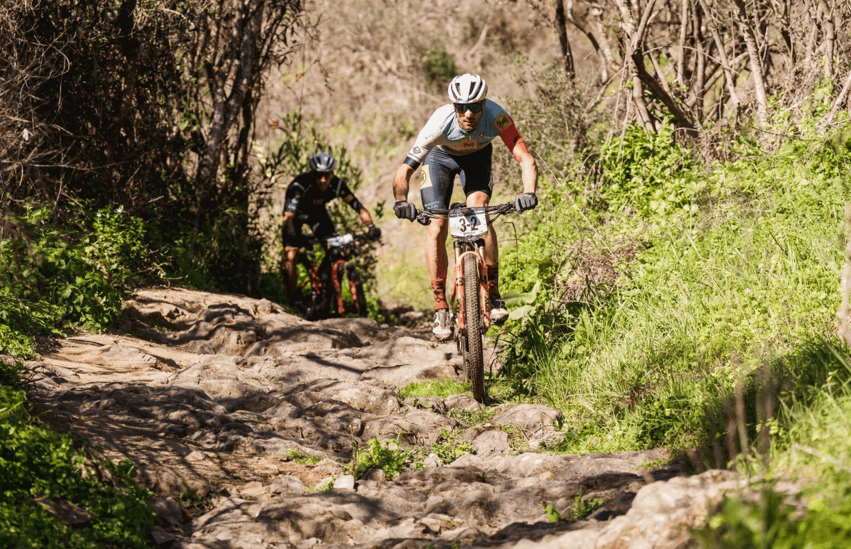 Cyclists racing through Andalucía mountains during the Andalucía Bike Race MTB stage race