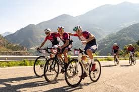 Cyclists climbing steep Pyrenean switchbacks during La Purito Andorra cycling event
