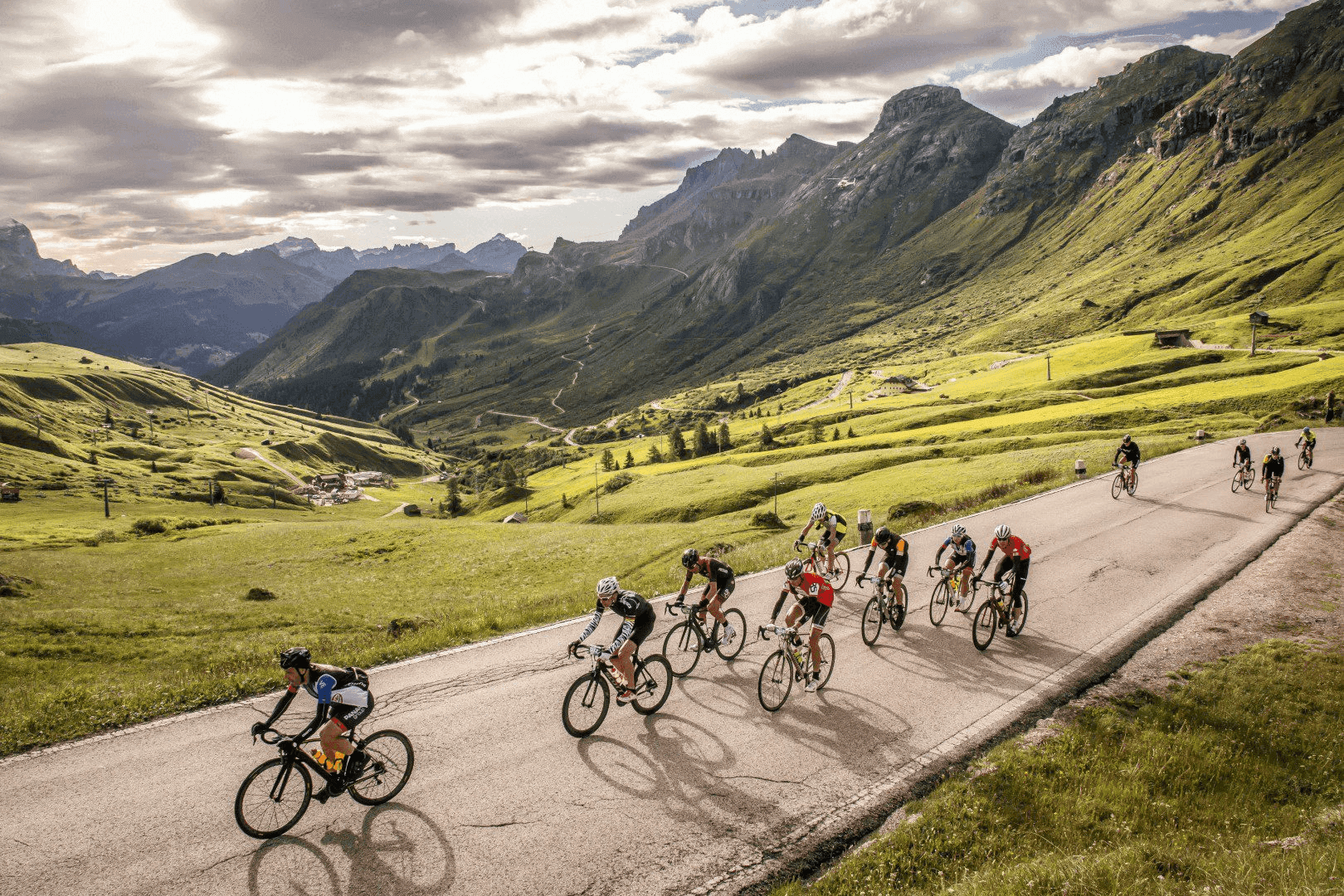 Cyclists climbing legendary Dolomite passes like Sella and Gardena during Maratona dles Dolomites